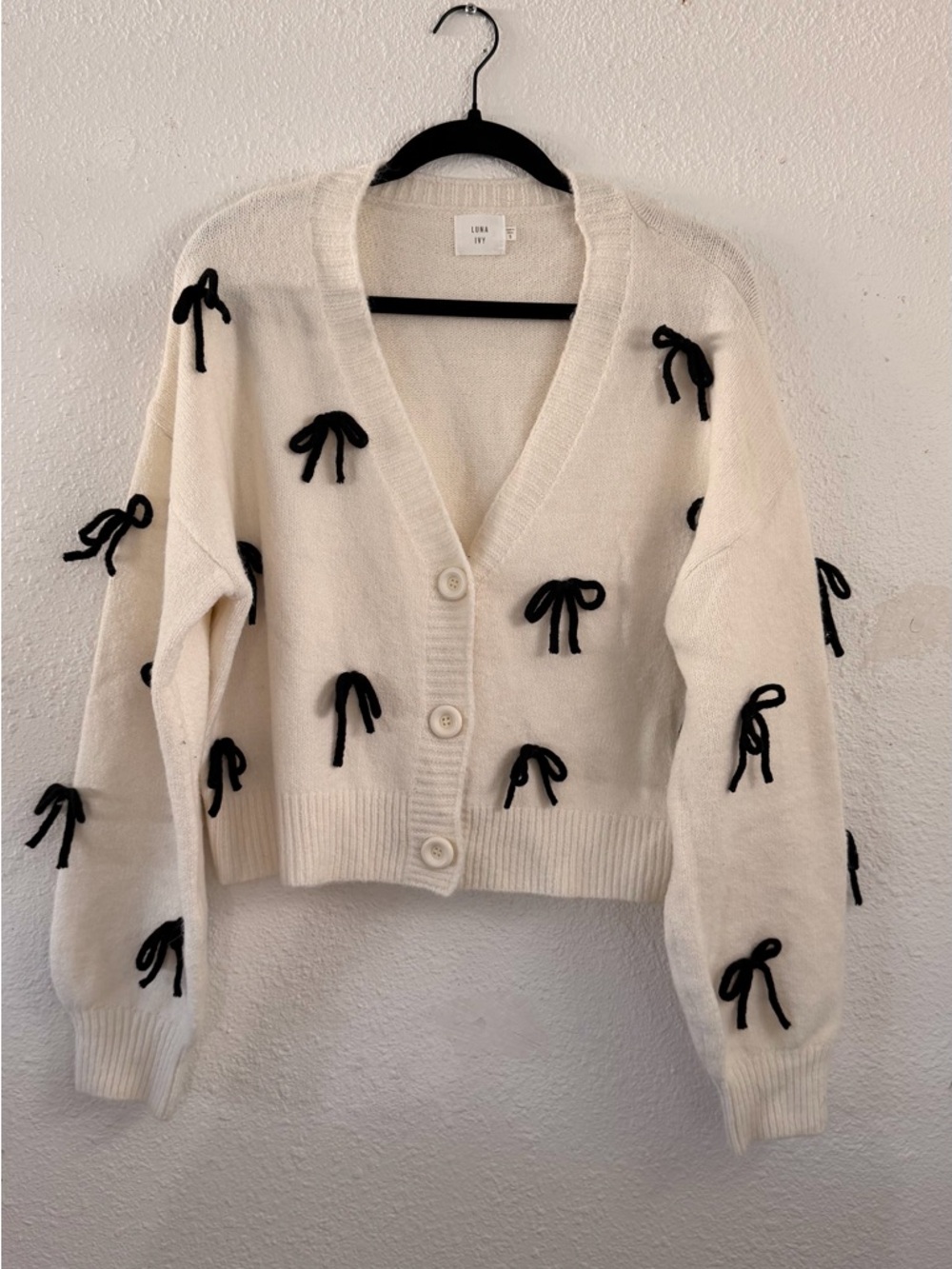Cream Cardigan Sweater with Black Bow Accents